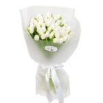 White tulip bouquet with wrapping and ribbon
