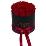 15 red roses in a black box with satin bow