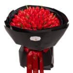 Bouquet of 101 red tulips in dark wrapping