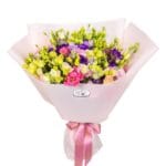 Colourful eustoma bouquet with wrapping and ribbon