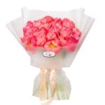 Coral peonies in a wrapped bouquet