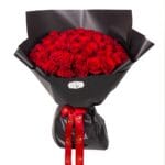 Red rose bouquet with wrapping and ribbon