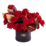 The One red flower box with golden palm leaves