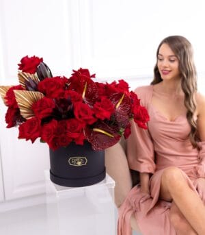 The One red flower box with golden palm leaves