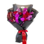 Autumn Fantasy bouquet with red and fuchsia flowers