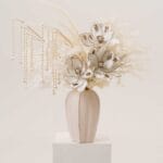 Winter Magnolia Luxe tall vase arrangement with ivory florals and pearls