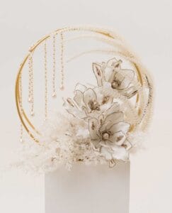 Celestial Halo arrangement with gold ring, magnolia-inspired flowers and pearls