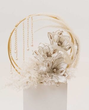 Celestial Halo arrangement with gold ring, magnolia-inspired flowers and pearls