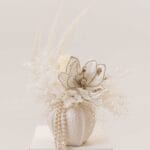 Opaline Grace magnolia-inspired arrangement with pearls in a ceramic vase