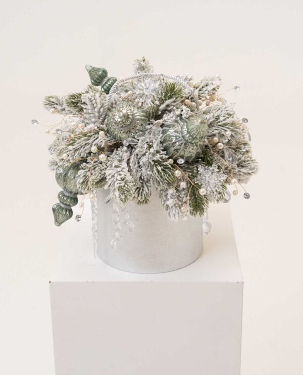 Crystal Round Arrangement with frosted pine and pearl accents in a ceramic vase